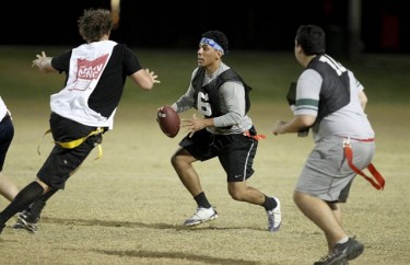 Jesse Villegas drops back during a 2012 GCU intramural football game. This season, more students than ever are participating in campus intramurals.(Photo by Darryl Webb)