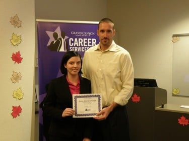 GCU senior Stephanie Craig, winner of the afternoon session of Thursday's Career Shootout, with Dr. Brian Smith, director of the Colangelo School of Sports Business.