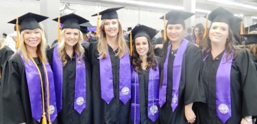 LaDon Escobar (third from left) with her nursing peeps backstage Thursday before commencement at the Coliseum. 
