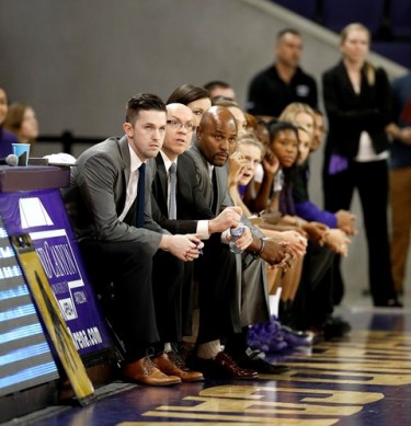 Women's basketball coach Trent May (second from left) and his staff sought normalcy for their team.