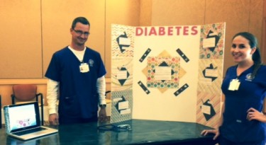 GCU nursing students Ryan Gardner and Karen Greenthal discussed diabetes with residents of a Scottsdale senior community during a health fair on Monday. (Photo courtesy of Barbara Kehn) 