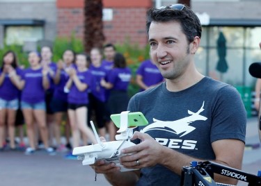 Steven Niedzielski sends the drone on its merry way to take more photos of Move-In activities.