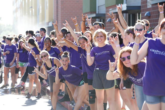 Nearly 1,300 purple-clad volunteers lined campus roads Wednesday to welcome new GCU students.