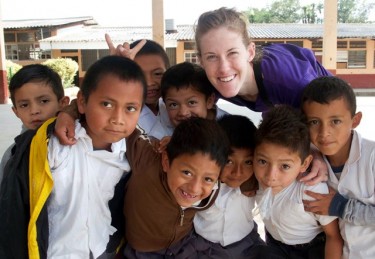 GCU student Nicole Peron and her new friends in Honduras. (Photo by Ray Chener) 