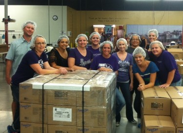 GCU online faculty members, from left, Rob Bjork, Cheryl Lira-Layne, Michelle Grande, Katie Kosier,  Katy Long, Nicole Lavonier, Leslie Foley and Emily Bergquist  and (back row) Sylvia Harkins and Mia Damiani, volunteered for Feed My Starving Children. (Photo courtesy of Emily Bergquist) 