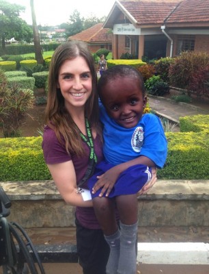 GCU student Cara Clancy and Arafat Mumbere, a 7-year-old Ugandan boy, shared Jesus love. (Photo by Mark Barrett of Cure International) 