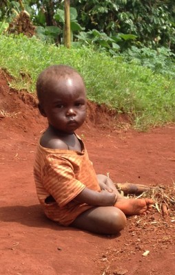 A boy sits alone in Uganda. (Photo by Mark Barrett of Cure International) 