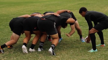 GCU rugby players demonstrated a scrum in a sevens match, where scrums are three players a side instead of the usual eight. Photo by Tyler McDonald