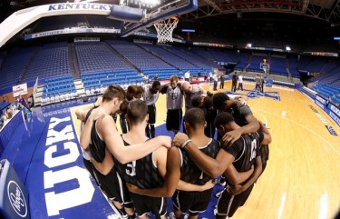 After getting warmed up, the team prays before the start of practice.