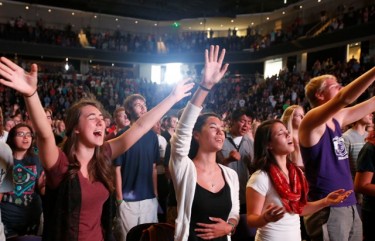 GCU students worship at Chapel last fall in the Arena. On average, about 5,000 people attend the service each week. 