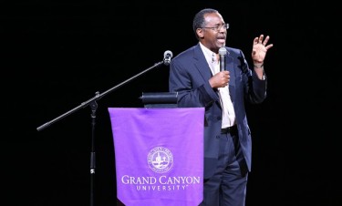 Dr. Ben Carson shared copies of his book, "One Vote: Make Your Voice Heard," with a GCU Arena crowd Thursday night. He also shared his personal experiences with academics, faith and politics. 
