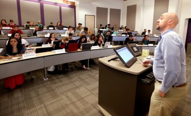 GCU professor Filippo Posta lectures to students during the Tuesday “ground” day of his spring Math 134 class. Posta led the first blended learning class at GCU last summer. (Photo by Darryl Webb) 