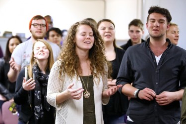Students at the Worship Summit join together in song at the start of class.
