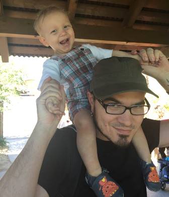 Atticus VanSlyke and his dad, Krys, have fun despite the little boy's cancer. (Photo courtesy of Krys VanSlyke)