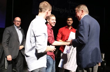 Grand prize winners of the 2015 Canyon Challenge (second from left) , Brad Scruggs, Brian Scruggs and Ahmad Saleem, are congratulated by judge Jerry Colangelo. 