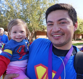 Alyssa Alvarez and her daddy, Alex, did the cancer survivors' walk together. Alyssa was diagnosed at age 3 months. 