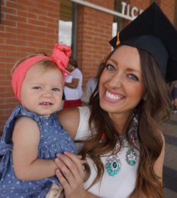 Cammie Thornton and baby Phoebe before commencement Thursday. 