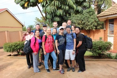 A large group of medical professionals from Pinnacle Family Practice, including Nicole and Brent Nedella (front row, black and blue T-shirts), returned to Uganda in 2014. (Photo courtesy of Nicole and Brent Nedella) 