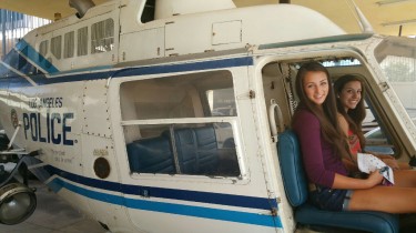 GCU students Hannah Clack (left) and Marlene Olivas sit in a Los Angeles Police Department helicopter during a recent justice-studies trip to California. (Courtesy of Cornel Stemley)