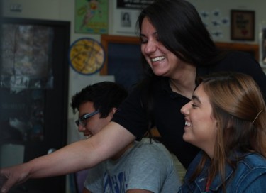Teacher Lisa Cass (center), a GCU alumna, enjoys teaching her students at Independence High. 