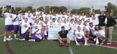 The GCU lacrosse team, with coach Manny Rapkin in the foreground, poses for the championship photo.