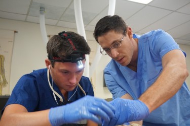 Premed seniors Josh France (left) and Jeremy Baker work on a human cadaver in their Bio-492-L internship at GCU's anatomy lab. 