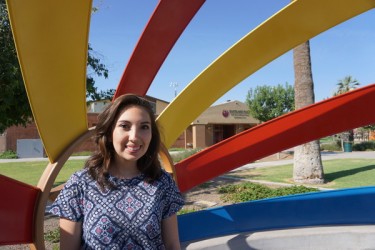 GCU public history student Naomi Ashley stands at a peace memorial at Phoenix's Eastlake Park, which she is helping the Phoenix Historical Preservation Office to research for an application to the National Register of Historic Places. (Photo by Michael Ferraresi)