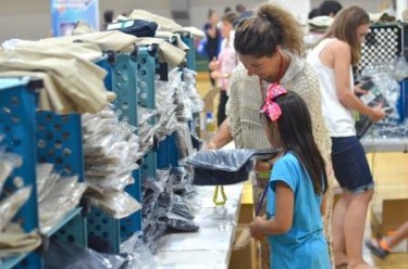 More than 3,000 volunteers fuel Back to School Clothing Drive's efforts, and the event is expected to serve more than 5,000 children from 40 school districts and other programs.