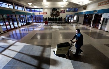 Zenon Castro cleans the vacant cafeteria of Mountain Vista during his shift as night custodian.