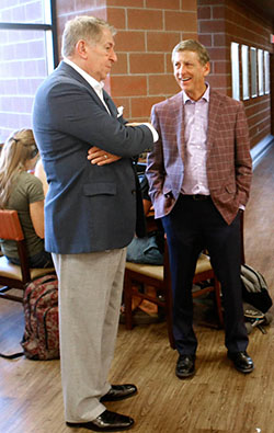 GCU President Brian Mueller (right) and the University team brought Colangelo on board as an adviser and named the business college after him in 2014.
