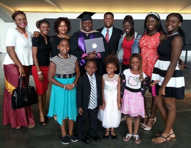 Komi Lokossou (holding diploma) and his family 