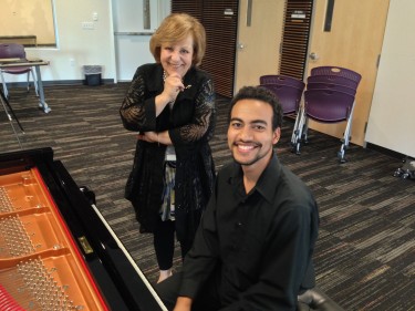 Instructor Dr. Jelena Vladikovich pauses during a recital by Omar Williams Jr. 