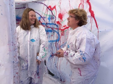 Courtney Hogan, left, and Diana Benson, teachers from the Sonoran Science Academy in Tucson, checked out the blood spatter tent.