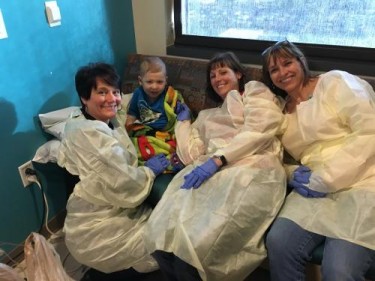 Jace and his teachers from Children of Hope Preschool, who visited him at Phoenix Children's Hospital to do a lesson with him.