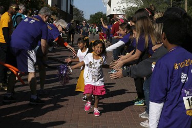 Victoria Gutierrez finishes the Cancer Survivors Walk.