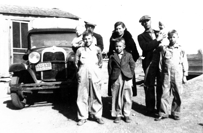 Whit and May Baker urged their five sons to graduate to a world far beyond the cotton, farmland and oil fields where they grew up, and the boys certainly did by all going to Grand Canyon College. That's Charlie, Jake and Sharky in the front row (left to right) and Randy (being held by cousin Velmer Hopper), May and Whit, holding Doug, in the back row.