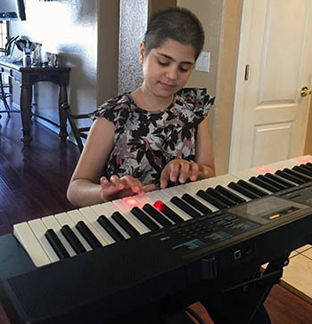 Liana has learned to play the piano all on her own during her time at home.