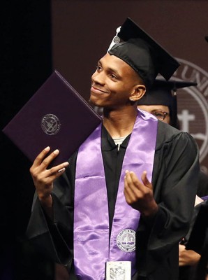 Dewayne Russell shows how he feels about getting his diploma. (Photo by Darryl Webb)