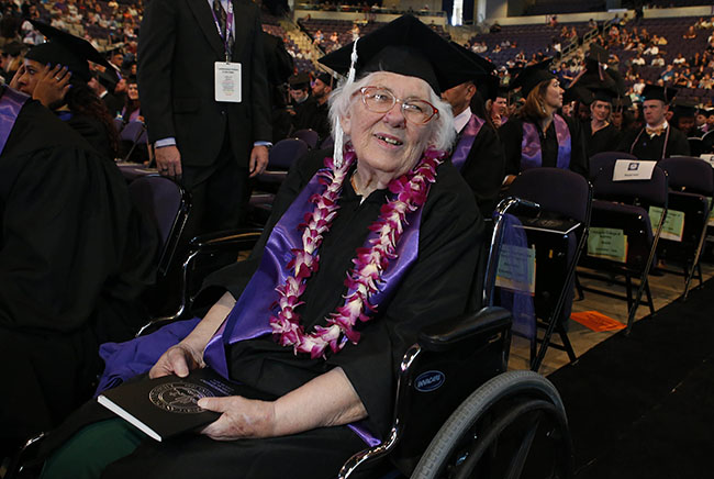 Diana Dilcher awaits the commencement ceremony Saturday. (Photo by Darryl Webb)
