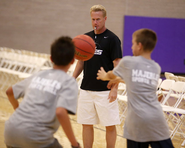 Associate head coach Todd Lee supervises a drill at last year's basketball camp.