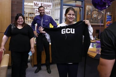 Tierney Gallagher shows off the new GCU hoodie that was in her goodie bag. That's her mother, Elizabeth, at left.