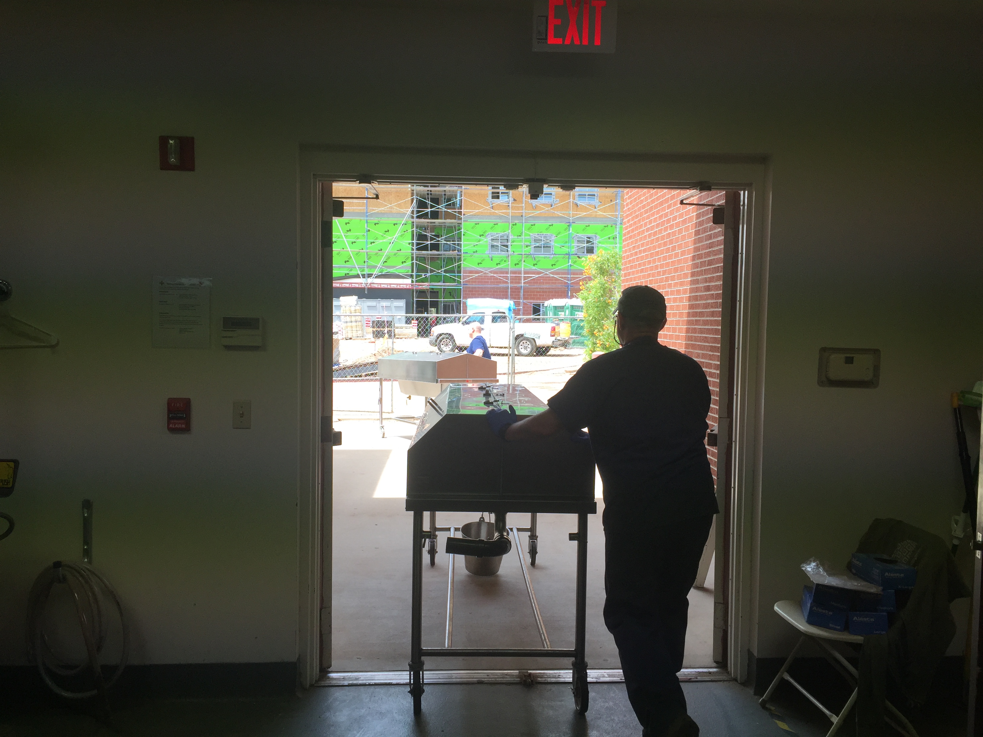 Michael Bodeen, CSET lead instructor for human dissection, helps wheel 12 cadavers the CCOB building. 