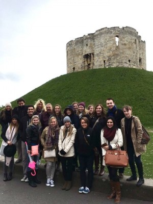 The students gather in front of Cliffords Tower in York.