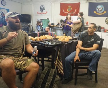 Larry Hinkle (left) stopped at Grand Canyon University on Wednesday to visit with other veterans.