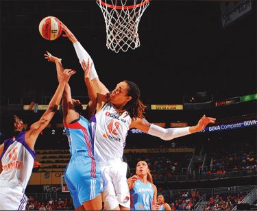 Brittney Griner doing what she is known for, blocking a shot. Photo courtesy from the Phoenix Mercury Media Guide. 