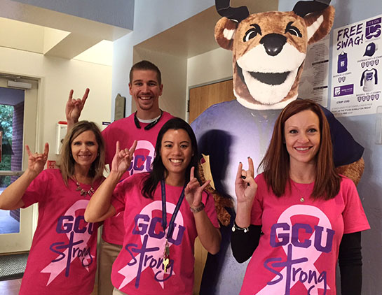 From left, CONHCP employees Connie Colbert, Brandon Warner, Maria Quimba and Pascale Lee pose with Thunder during a kickoff for the Making Strides Against Breast Cancer walk.