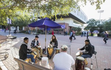 Anyone who walks by on the Promenade can join the drum circle.