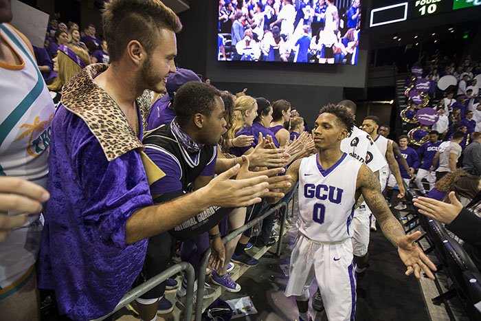 DeWayne Russell leads the Lopes around the Arena as they greet fans after a game.