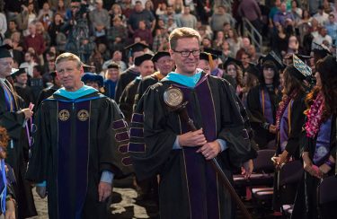 GCU President Brian Mueller (left) and Dr. Tim Griffin, GCU's pastor and dean of students, lead the procession into commencement.