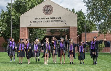 A group of nursing grads celebrate graduation together. (Photo by Slaven Gujic)